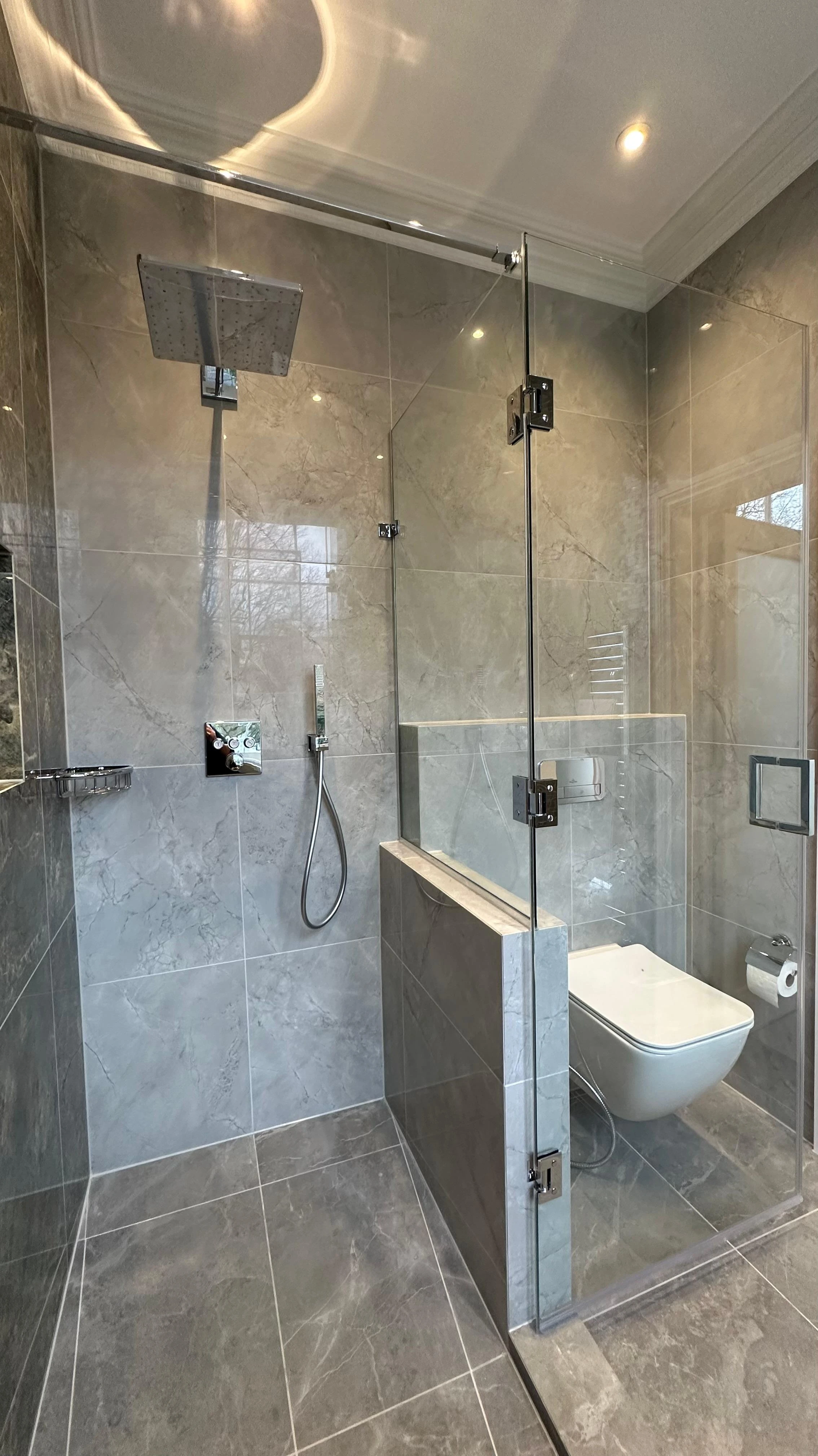 Glass shower enclosure